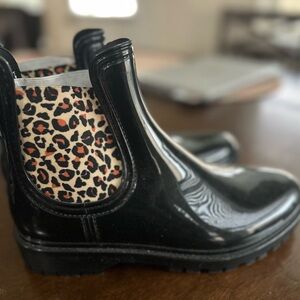 Used Black with cheetah rain boots. Size 10 women